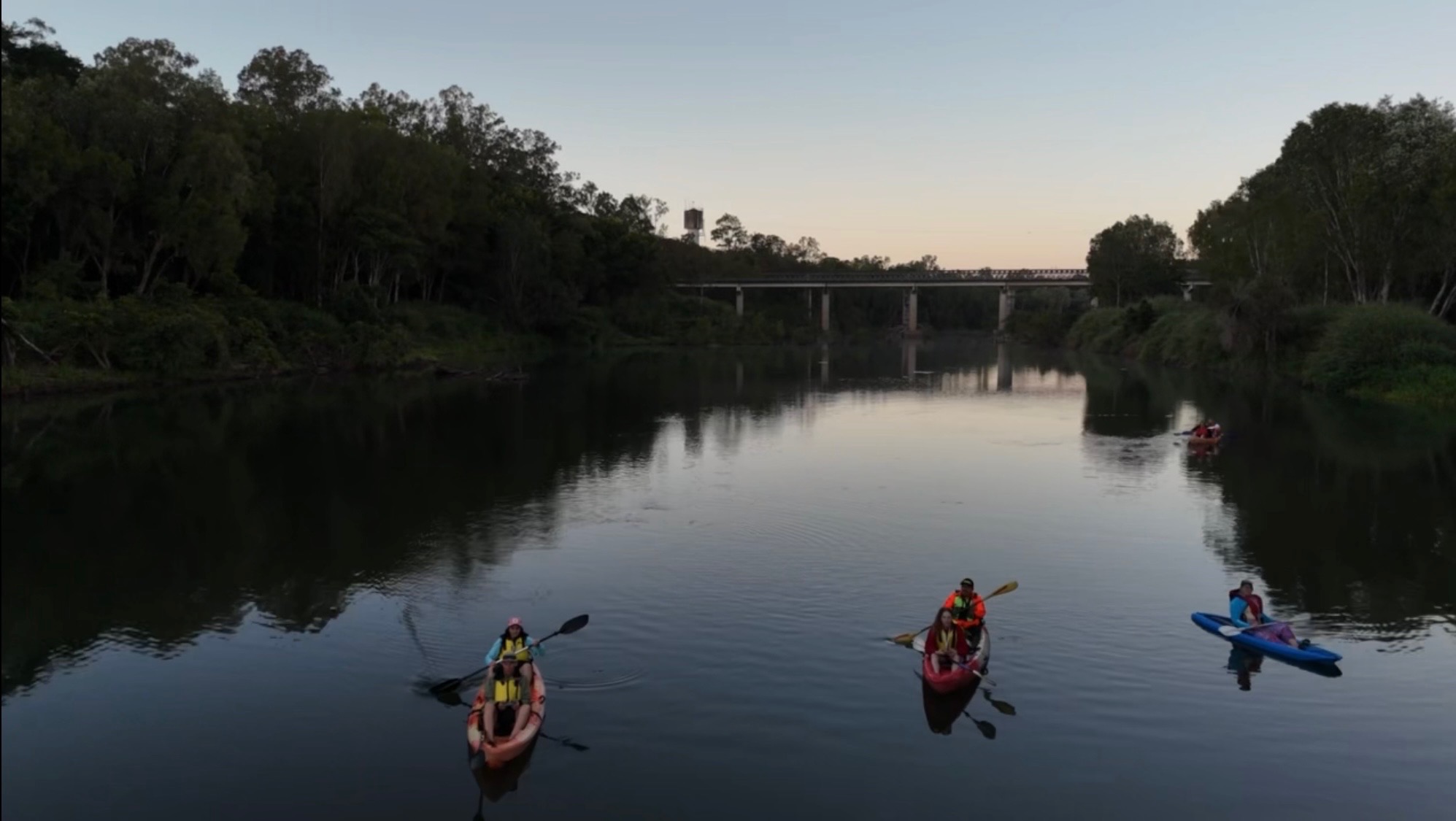 Platypus Adventures kayakers on the Pioneer River near the bridge