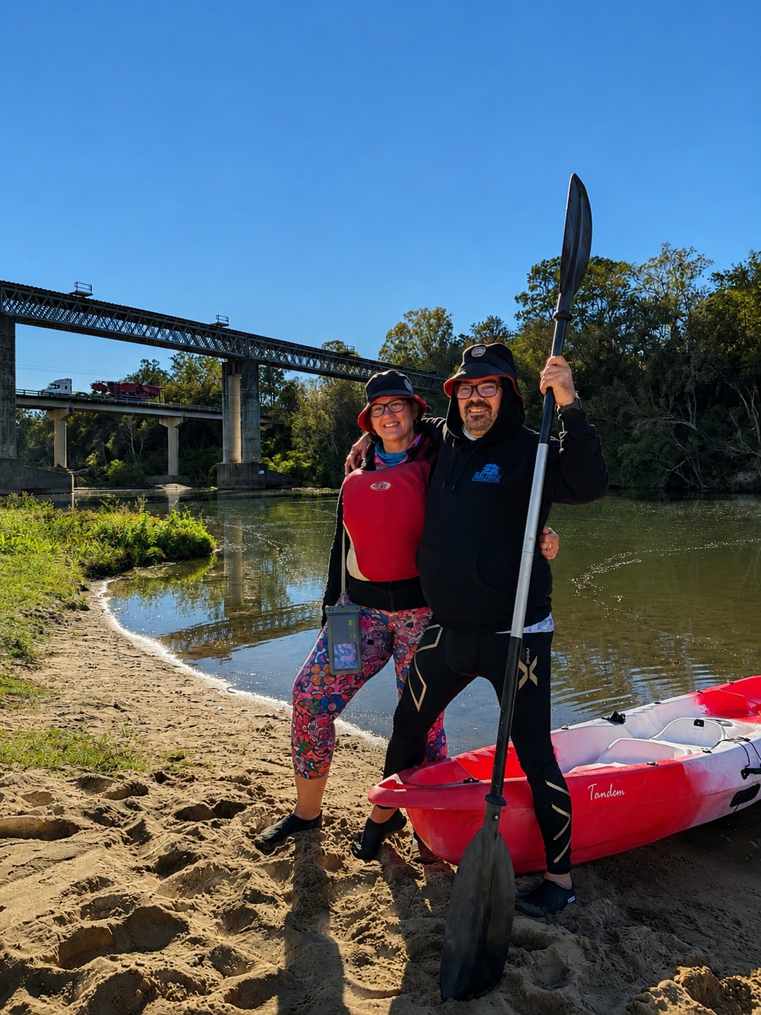 Christine and John beside their tandem kayak on the Pioneer River